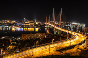 Fototapeta na wymiar Top view of the night Vladivostok with the Golden Horn bridge and the bridge Russian. Far East, Russia
