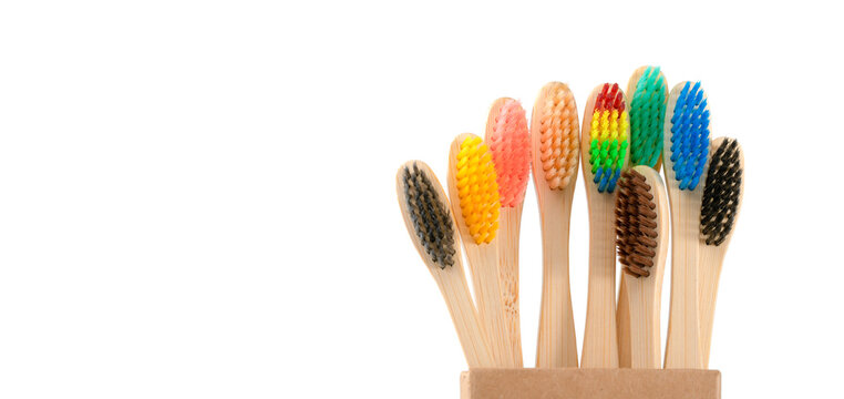 Multicolored Wooden Toothbrushes On A White Background, Plastic Rejection Concept