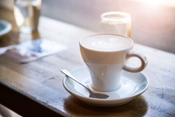 Italian coffee concept: Fresh brewed cup of cappuccino in a café