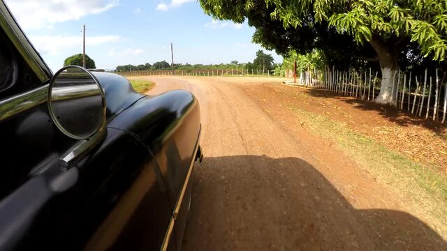 POV Driving on the old american car at Cuba countryside.