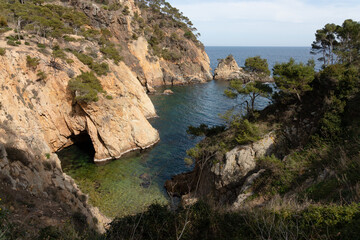 Creek in the mediterranean sea. Small private beach hidden in the rocks