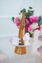 cake table decorated with flowers for wedding