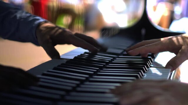 a pianist plays the piano at a picnic in a secular society