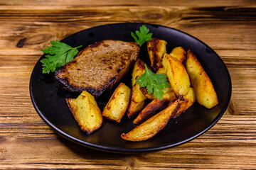 Roasted beefsteak with the fried potato and parsley