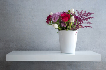Fototapeta na wymiar Spring flowers on shelf design