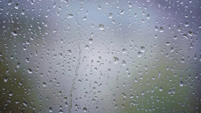 Window with rain drops, condensate or steam after heavy rain, large texture or background	Window with rain drops, condensate or steam after heavy rain, large texture or background	