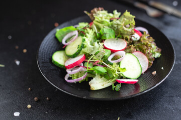 vegetables salad radish, cucumber, mix leaves petals meal snack keto or paleo diet vegan or vegetarian food copy space food background rustic. top view
