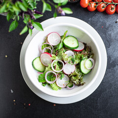 vegetables salad radish, cucumber, mix leaves petals meal snack keto or paleo diet vegan or vegetarian food copy space food background rustic. top view
