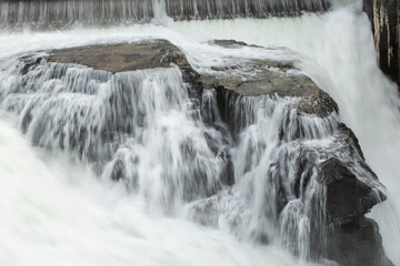 Fototapeta premium Waterfall rushing over rocks.