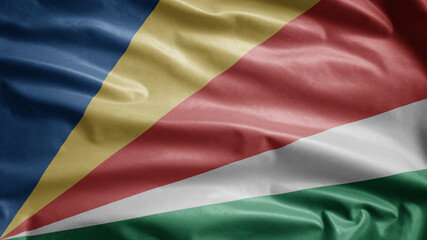 Seychellois flag waving in the wind. Seychelles banner blowing soft silk.