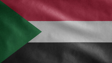 Sudanese flag waving in the wind. Close up of Sudan banner blowing soft silk.