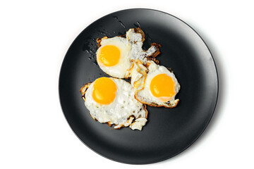 Scrambled eggs from 3 eggs on gray plates on white background