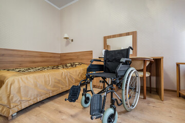 Interior of the bedroom with wheelchair in apartments or hotel for people with disabilities,...