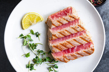 tuna grilled seafood fried barbecue fish second course meal snack  keto or paleo  pescetarian diet vegetarian food copy space food background rustic. top view