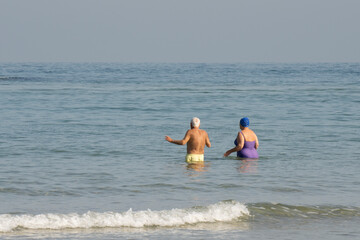 Fototapeta na wymiar An Elderly Couple Going for a Swim