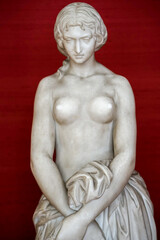 Fototapeta na wymiar white stone sculpture of women showing breasts 