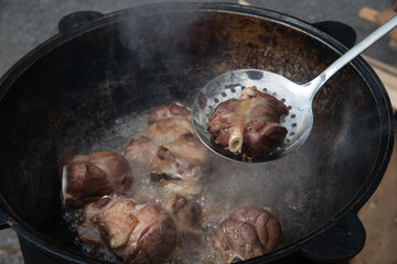 cooking in a pan lamb meat for plov 