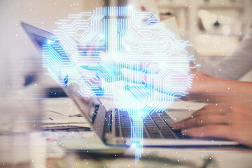 Multi exposure of woman hands working on computer and brain hologram drawing. Ai concept.