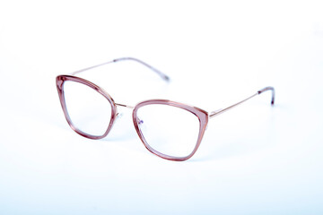 Fototapeta premium Eyeglasses on white background with copyspace