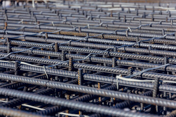 Construction rebar steel work reinforcement. Reinforcements steel bars stack. Close up steel construction rebar. Brand new armature.