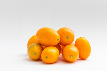 kumquat on white background. exotic fruits