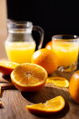 table full of fresh oranges and juice in springtime