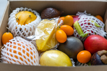 Still life of fruit in a box isolated on white