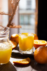 table full of fresh oranges and juice in springtime