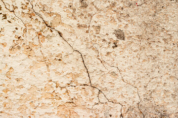 Texture of a concrete wall with cracks and scratches which can be used as a background