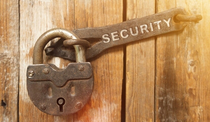 There is a lock on the door on the metal part of which it is written - SECURITY
