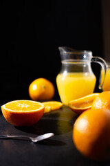 table full of fresh oranges and juice in springtime