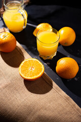table full of fresh oranges and juice in springtime