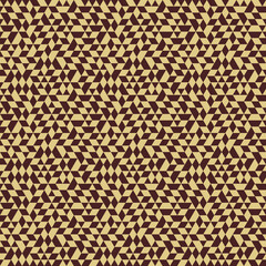 Geometric pattern with golden triangles. Geometric modern ornament. Seamless abstract background