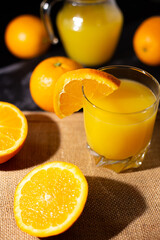 table full of fresh oranges and juice in springtime
