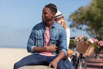 Fototapeta premium happy smiling couple at the beach hugging