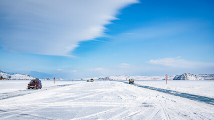 Clouds over winter ice highway