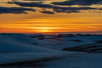 Sunset over Snow Covered Fields
