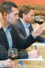 portrait of team wine tasting