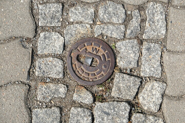 rusty water hydrant cover of the road