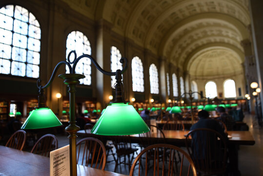 Elegant vintage green lamp on background of blurred library