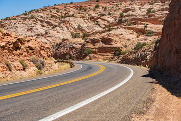 Road against the high rocks. Asphalt highway road.