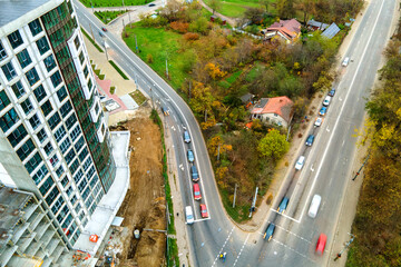 High rise apartment buildings and streets with traffic in city residential area.