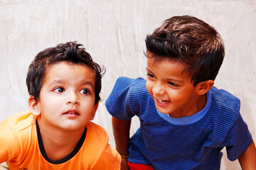 two indian young baby boy brothers in joyfull