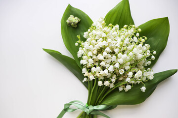 postcard mockup. small spring bouquet of lilies of the valley and space for text