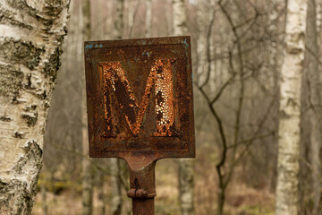 Old and rusty meeting point road sign..