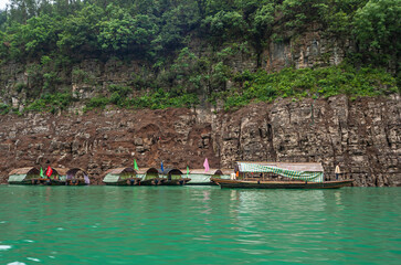 Wushan, Chongqing, China - May 7, 2010: Mini Three Gorges. 8 covered tourist sampans with docked...