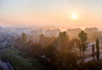 Panoramic top aerial view of modern city at dawn