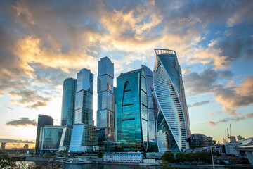 Fototapeta na wymiar Moscow City - a view of the skyscrapers Moscow International Business Center. Evening light. Reflection in the river.