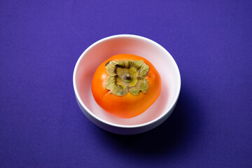 persimmon fruit on a plate