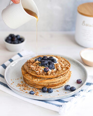 Pancakes with Blueberries, Maple Syrup, Kokos Yogurt on white background